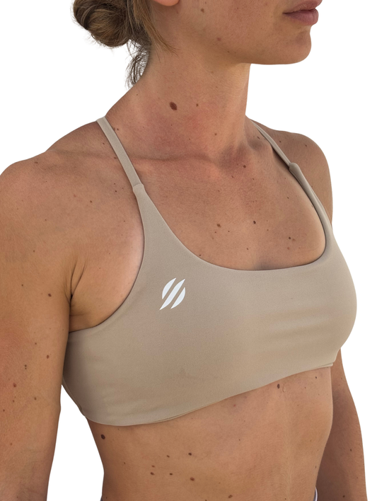 Top deportivo nude tirantes cruzados espalda